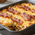 Keto Bacon Cheeseburger Casserole topped with melted cheese and crispy bacon